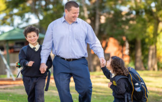 Sydney Catholic Schools Road Safety Education Officer, Andrew Sortwell, walking his children to school.